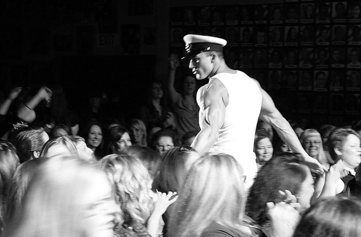 Professional black-and-white candid photo of Thomas Rooney (Tom Rooney) performing his Naval Officer routine, author of Reflections of a Male Revue Headliner: How to Win at Life and Love
